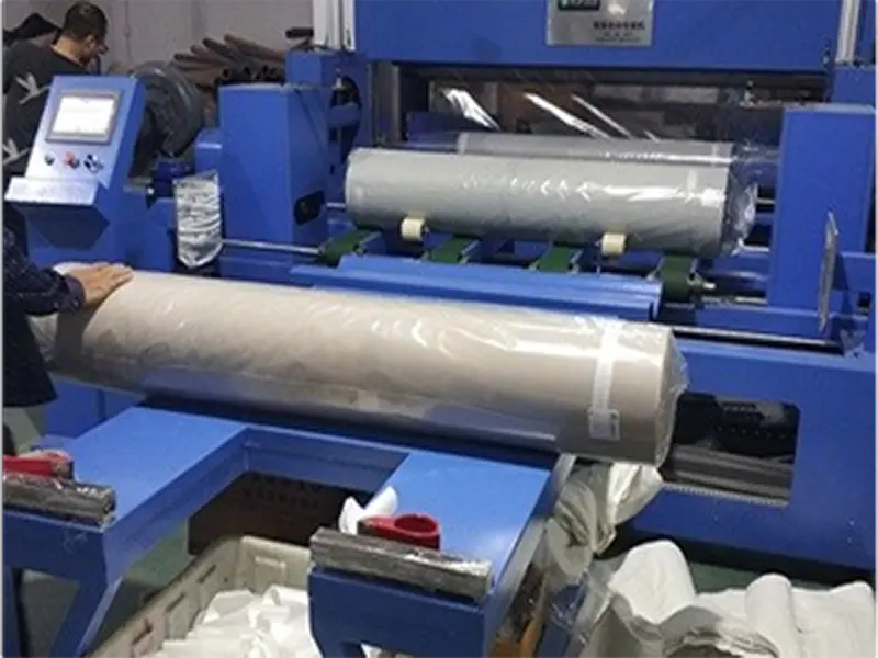 Fabric roll packaging process in textile manufacturing