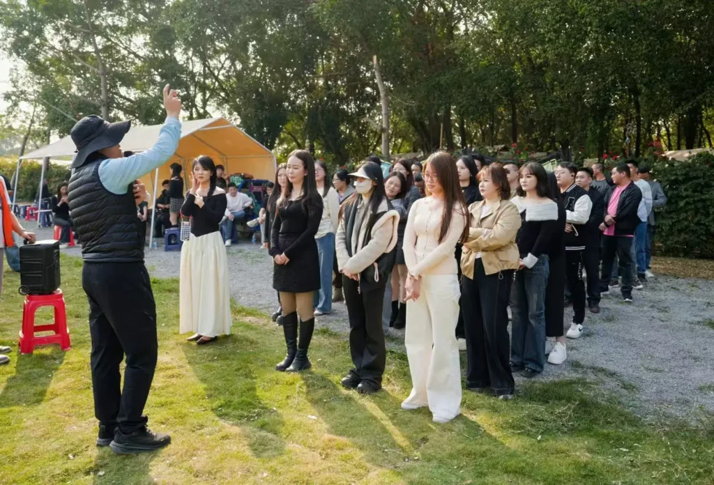 Employees participating in a company team building line activity