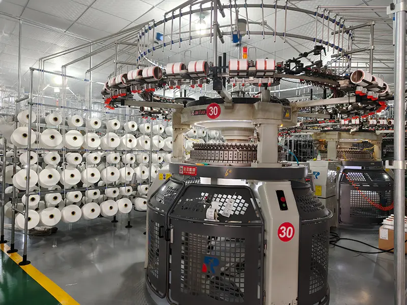Circular knitting machine in MUYUE Textile fabric manufacturing workshop