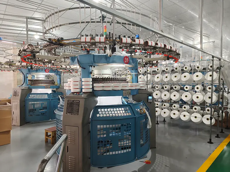 Large-scale knitting production workshop with advanced circular knitting machines at MUYUE Textile