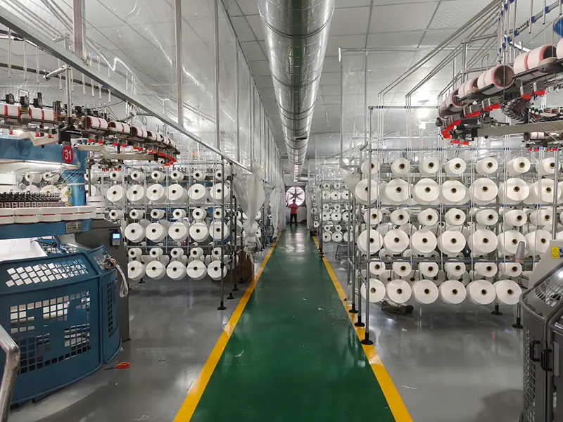 Yarn feeding process in MUYUE Textile fabric production line